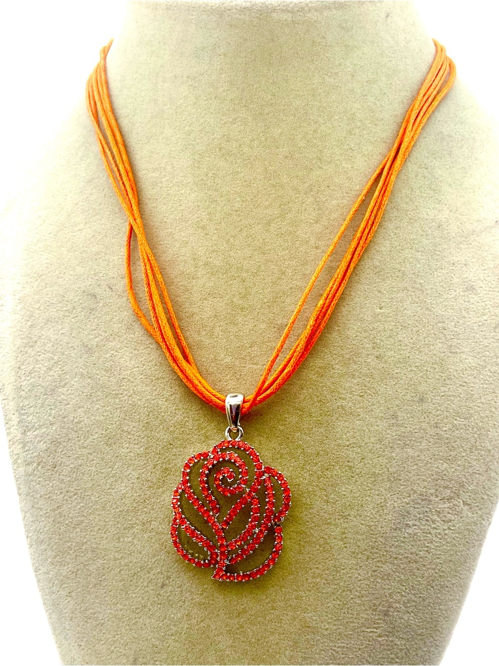 Orange Rose Crystal Pendant Necklace with Multiple Orange Cords. 18 inches